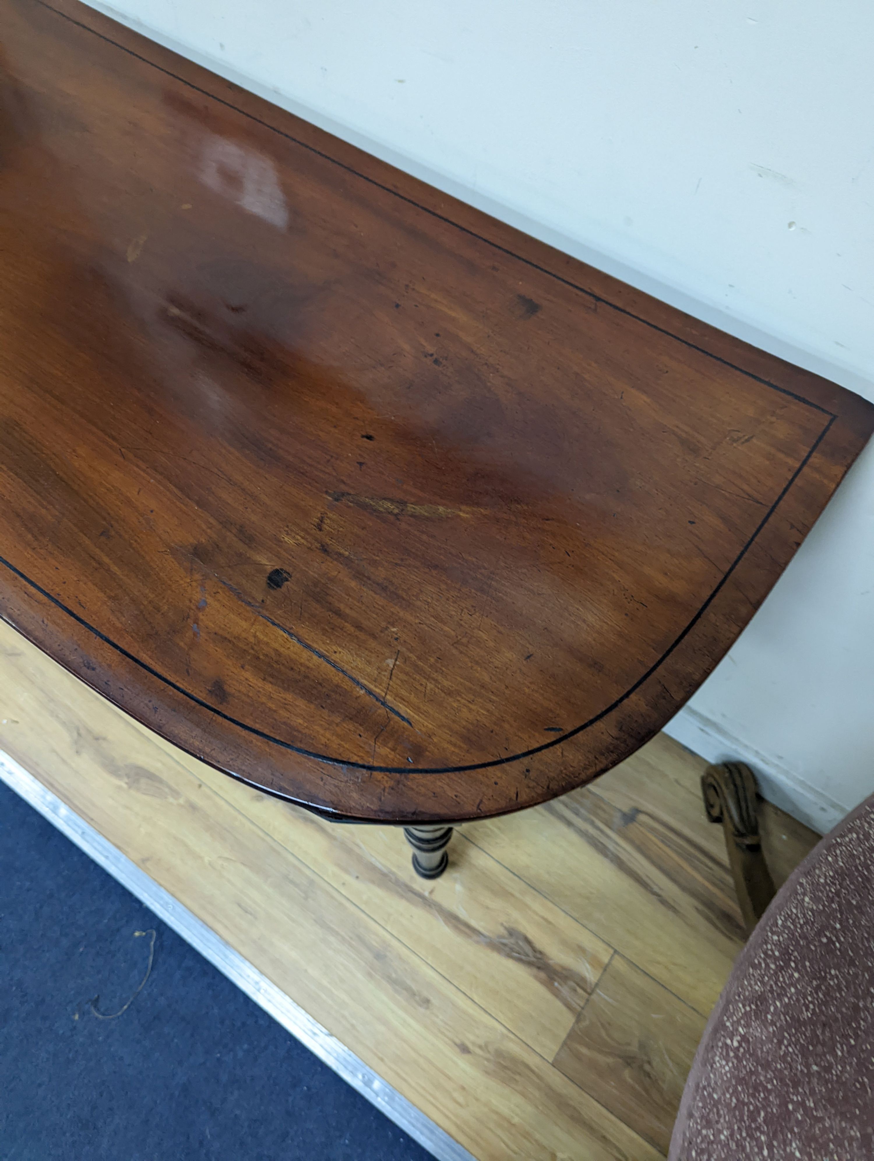 A Regency mahogany D shaped folding card table, width 91cm, depth 46cm, height 74cm